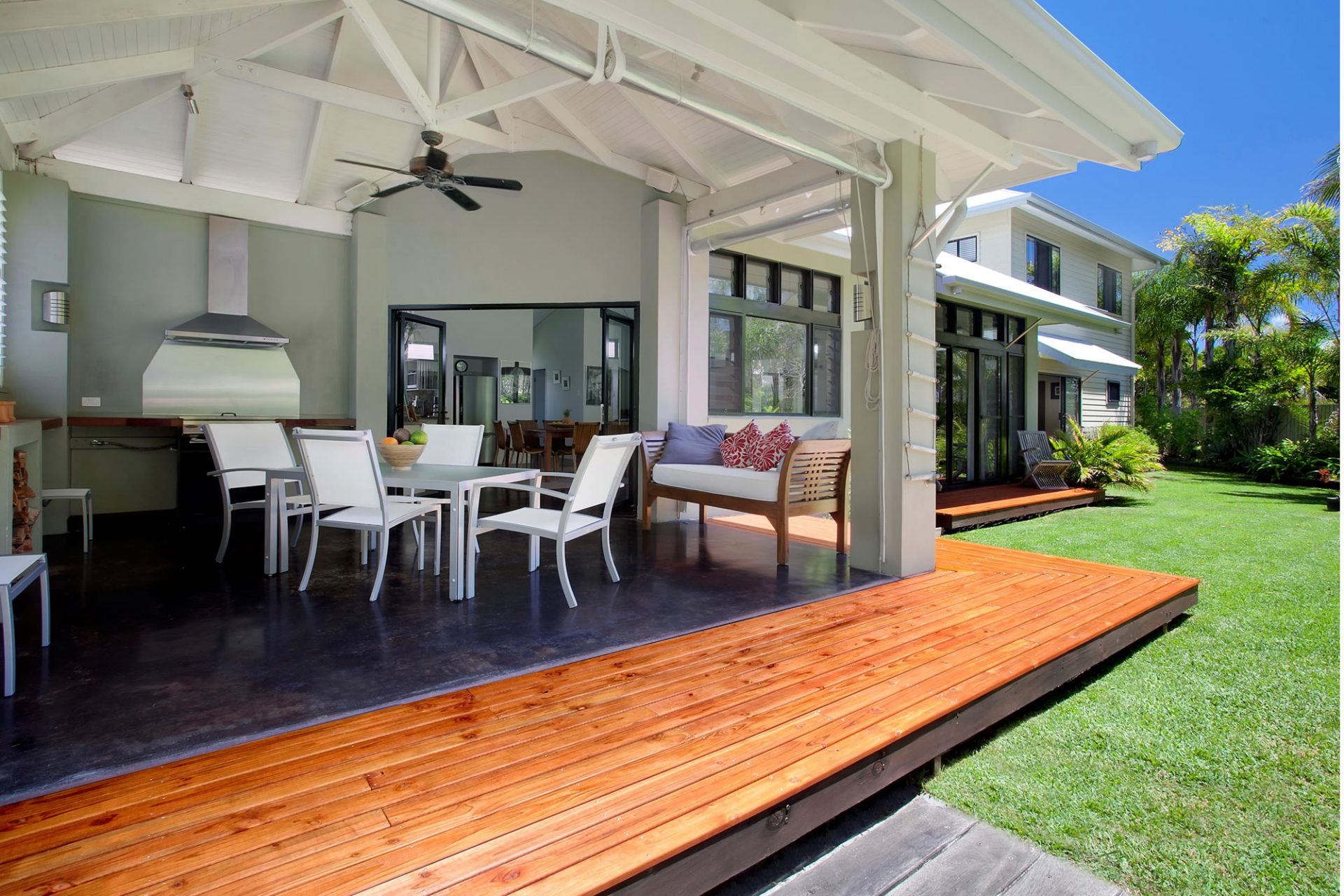 Open plan dining room and backyard deck