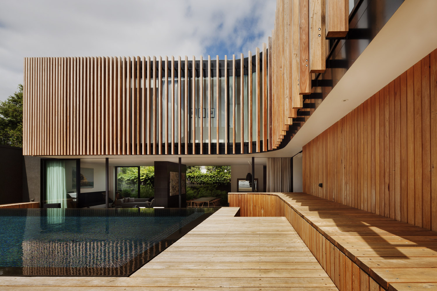 Outdoor pool area and deck with light timber